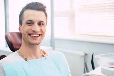 man showing off the results of his smile makeover from Beautiful Smiles of Arizona