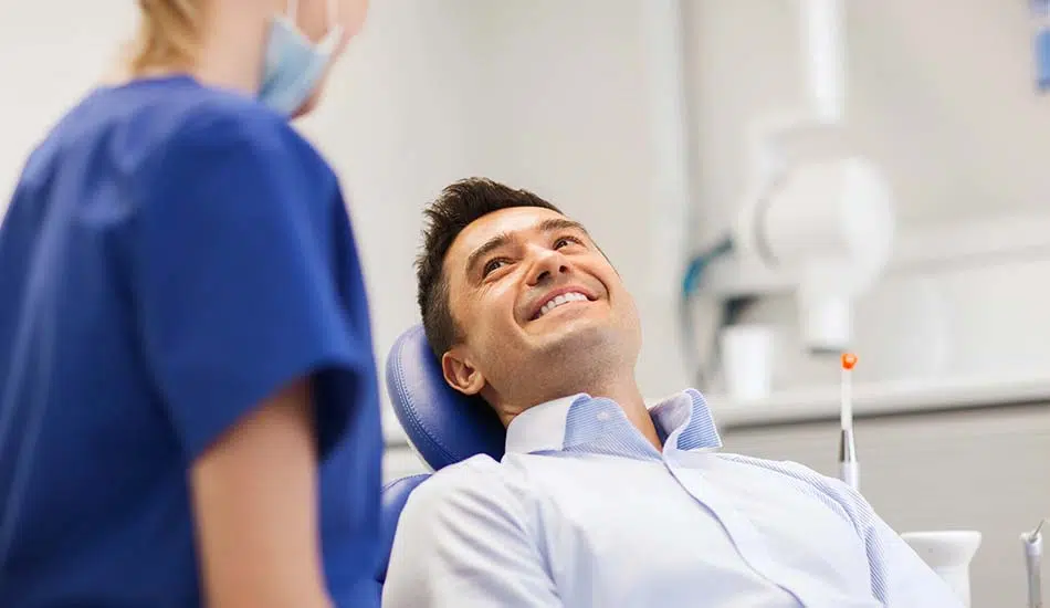 man smiling during his dental appointment at Beautiful Smiles of Arizona